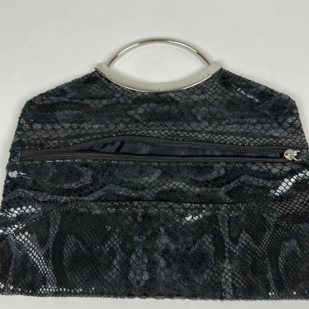 Bebe faux snake skin clutch with silver hardware